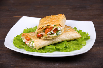 Pita bread wrapped with cottage cheese and vegetables