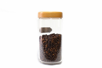 Coffee beans in a glass jar isolated