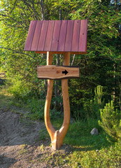 Wooden sign board  in forest