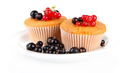 Tasty muffins with berries isolated on white