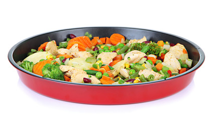 Casserole with vegetables and meat on pan, isolated on white