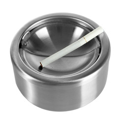 Metal ashtray and cigarette isolated on white