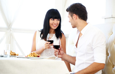 Beautiful couple having  romantic dinner at restaurant