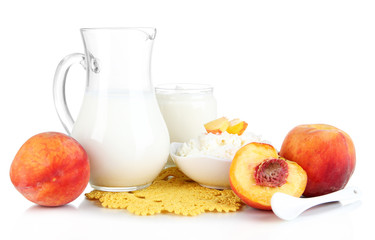 Fresh dairy products with peaches isolated on white