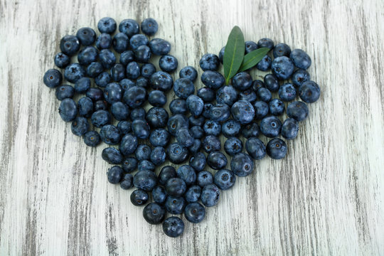 Heart Of Blueberries On Wooden Background