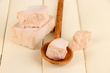 Dry yeast on wooden table close-up