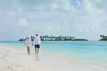 happy young couple have fun on beach