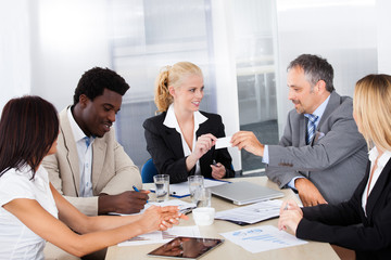 Businesspeople Exchanging Visiting Card