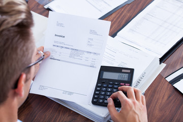 Businessman Using Calculator