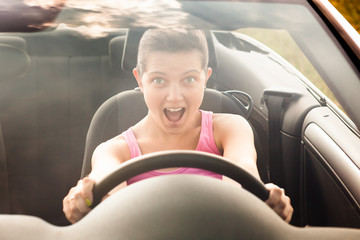 Happy Woman Sitting In Driving The Car