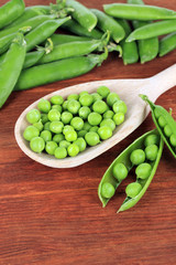 Sweet green peas on wooden background