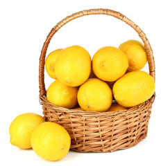 Ripe lemons in wicker basket isolated on white