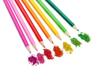 Colour pencils with sharpening shavings isolated on white