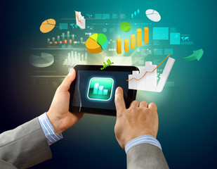 Close-up of hands holding tablet pc