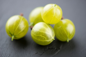 Berry fruits: green gooseberries, studio shot