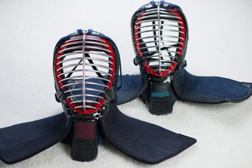 Horizontal shot of two kendo protective helmets