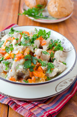 Rabbit stew with vegetables and sour cream