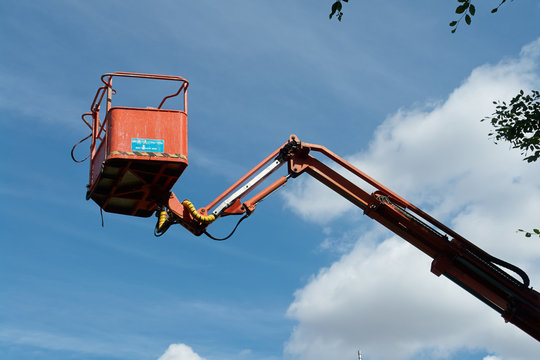 Tall mobile crane with sky background