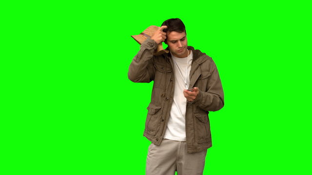 Lost man using his compass on green screen