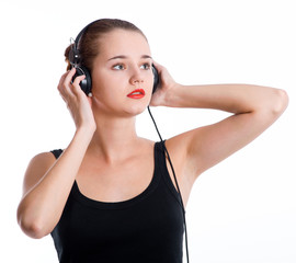 Naklejka premium Young woman with headphones listening music