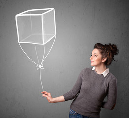 Woman holding a cube balloon