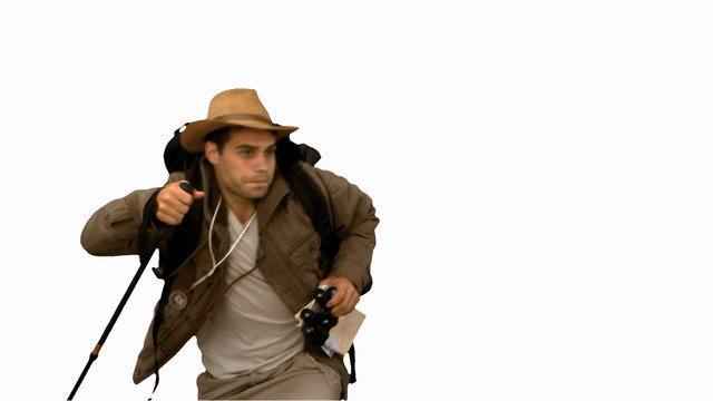 Man orienteering while holding a hiking stick on white screen