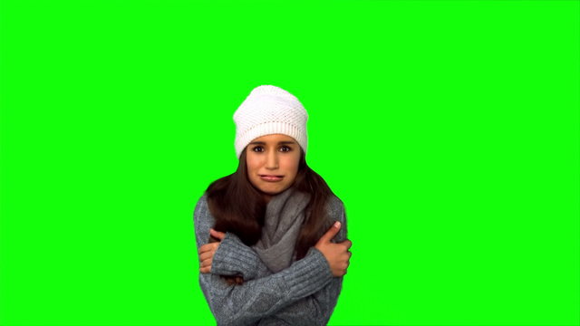 Cold young woman shivering