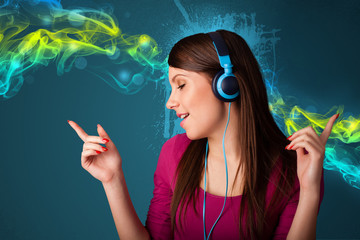 Young woman listening to music with headphones