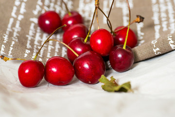 fresh cherries on brown napkin