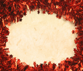 Holiday Background with red tinsel and old paper