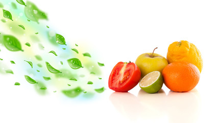 Colorful fruits with green organic leafs