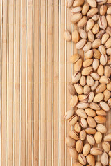 pistachios  lying on a bamboo mat