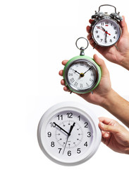 Hand with alarm clock.
