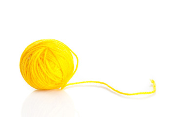 Yellow wool yarn ball isolated on white background