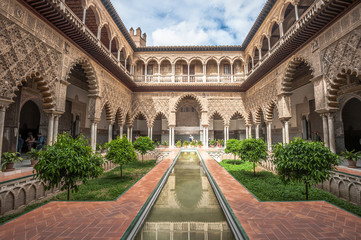 Patio in Royal Alcazars of Seville, Spain - obrazy, fototapety, plakaty