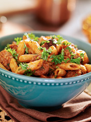 bowl of rigatoni pasta with sausage
