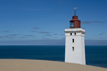 Fototapeta na wymiar Lighthouse on a Sand Dune
