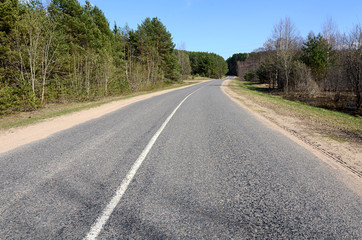 Fototapeta na wymiar Asphalt road in a countryside