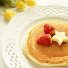 strawberry and butter on pancake