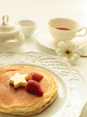 strawberry and butter on pancake