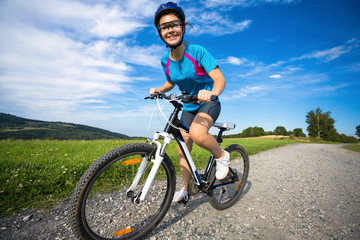 Fototapeta premium Healthy lifestyle - teenage girl biking