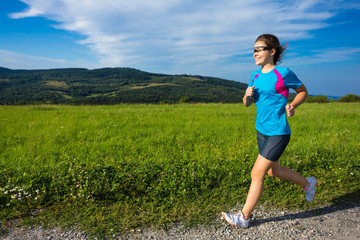 Teenage girl running, jumping outdoor