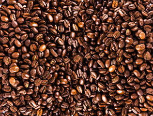 Roasted brown coffee beans  background or texture closeup