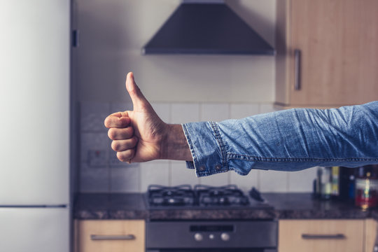 Thumbs up in clean and tidy kitchen