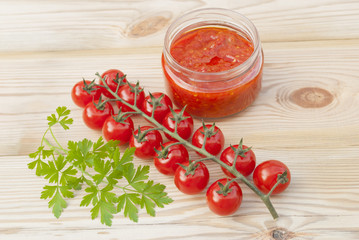 Red tomatoes on a wooden table.