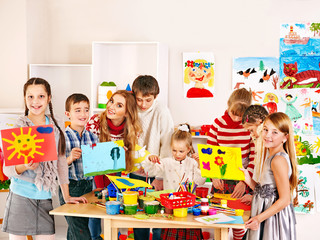 Child painting at art school.