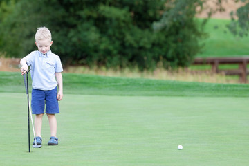 boy playing golf