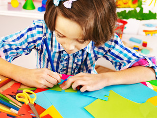 Child with  scissor at school.