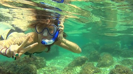 girl diving in adriativ sea