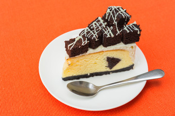 A piece of brownie cheesecake